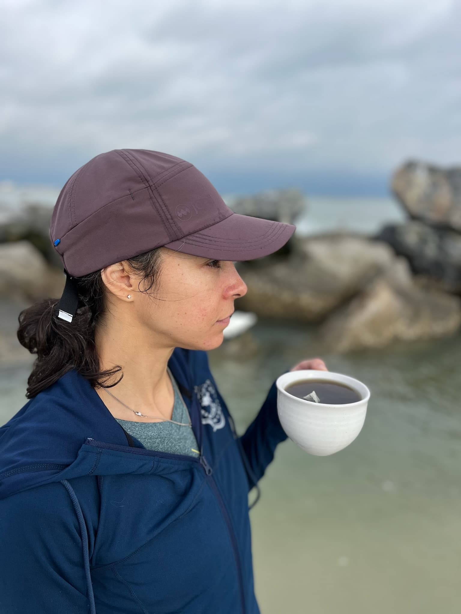 Woman drinking yaupon tea on the beach
