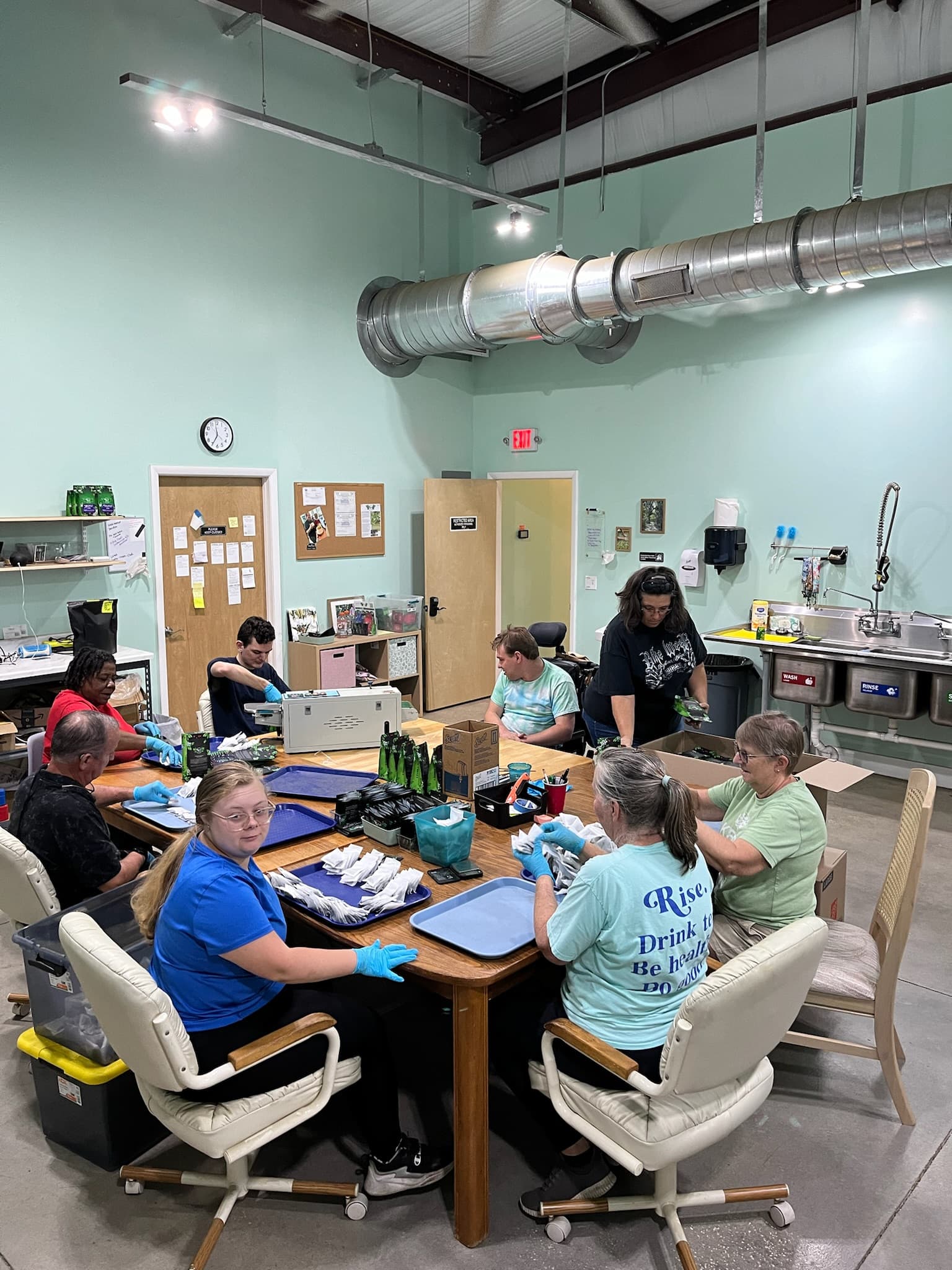 Rise Yaupon team hand-packing orders